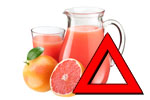 Grapefruktjuice med legemidler og varsel trekant