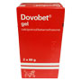 Rød og hvit medisin eske med psoriasis gel